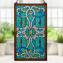 26"H Tiffany Style Stained Glass Brandi's Window Panel, shown hanging against a blurred window and plant background.