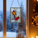 18.5"H Northern Cardinal Songbird Stained Glass Window Panel hanging in a window with snowy landscape.