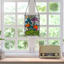 11.5"H Erin Green Mushrooms Stained Glass Window Panel hanging above a vintage radio on a windowsill.