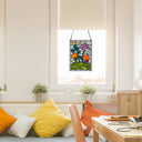 11.5"H Erin Green Mushrooms Stained Glass Window Panel hanging above a table with cushions in a bright room.