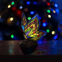 9.5"H Stained Glass Butterfly Wings Accent Lamp with a blurred festive background