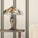 24.5" H Halston Double Lit Amber Bowl Shade Stained Glass Table Lamp on a wooden table against a striped wallpapered wall.