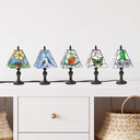 12" H Multicolor Set of Five Stained Glass Mini Accent Lamps on a white shelf with a drawer and open cubbies with wicker baskets