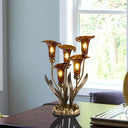 20"H Hand Blown Glass 5 Calla Lily Uplight Accent Lamp on a table near a window