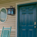 River of Goods Aqua and Amber Stained Glass and Black 1-Light Outdoor Lantern Wall Sconce