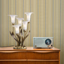 20"H Hand Blown Glass 5 Calla Lily Uplight Accent Lamp on a wooden cabinet against a striped wallpapered wall.