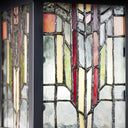 River of Goods Red Stained Glass and Black 1-Light Outdoor Lantern Wall Sconce