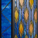 River of Goods Blue Stained Glass and Black Metal Rectangular 1-Light Outdoor Wall Sconce