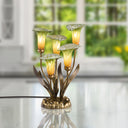 20"H Hand Blown Glass 5 Calla Lily Uplight Accent Lamp on a reflective surface with a window in the blurred background