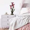21.5" H Lily 3 Light Table Lamp on a bedroom nightstand